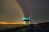 A double rainbow is seen on Nevada Route 146 during rainfall on Friday, Aug. 18, 2023, in Las V ...