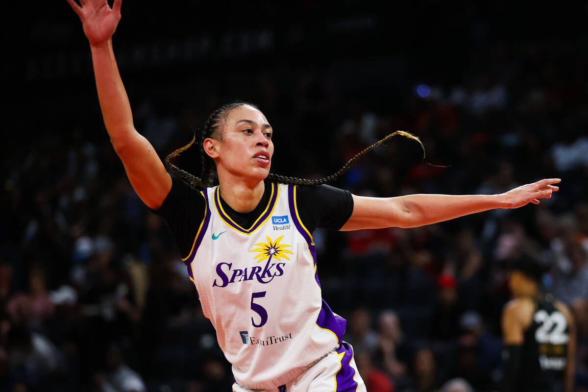 Los Angeles Sparks forward Dearica Hamby (5), a former Aces player, puts her hands up in a defe ...