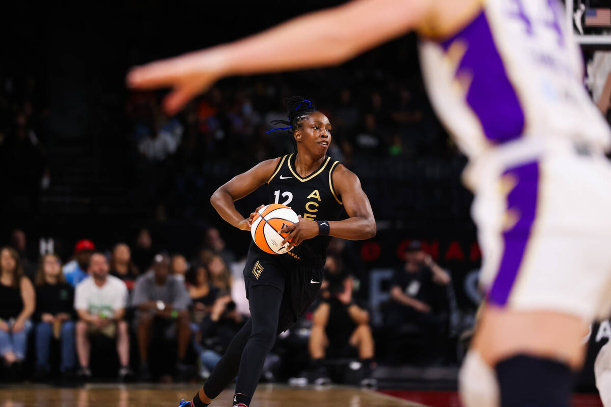 Las Vegas Aces guard Chelsea Gray (12) charges down the court during a WNBA game against the Lo ...