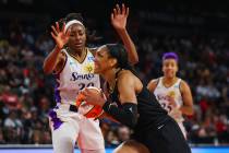Las Vegas Aces forward A'ja Wilson (22) rushes to the net past Los Angeles Sparks forward Nneka ...