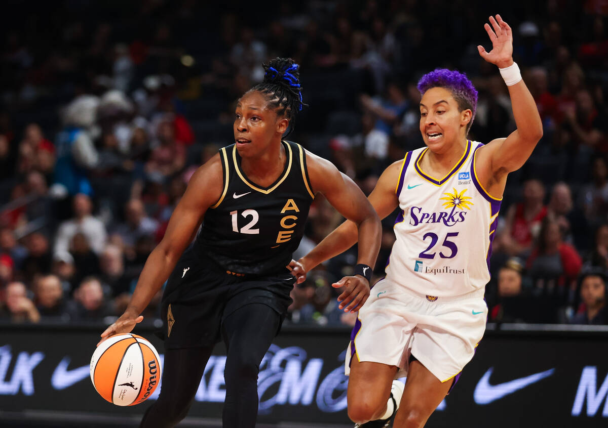Las Vegas Aces guard Chelsea Gray (12) looks to pass the ball while Los Angeles Sparks guard La ...