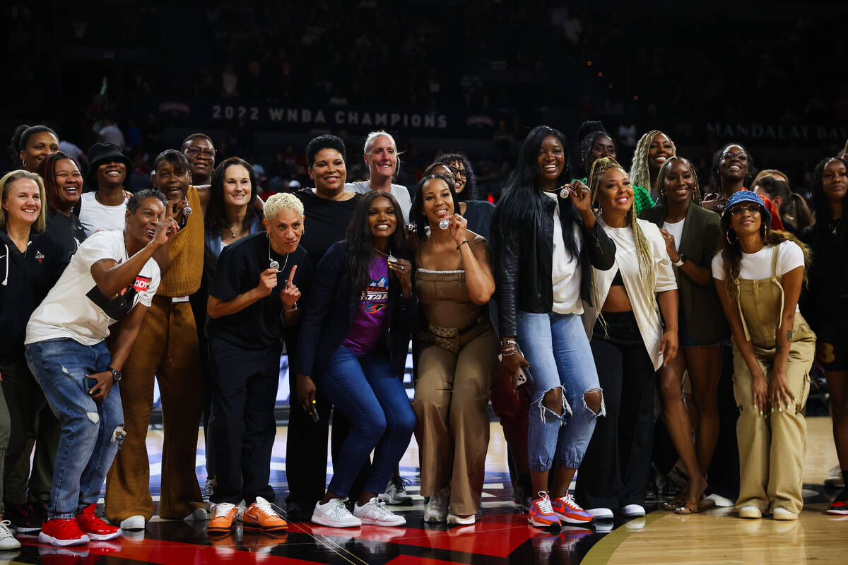 Las Vegas Aces alumni gather on the court at halftime during a WNBA game between the Las Vegas ...