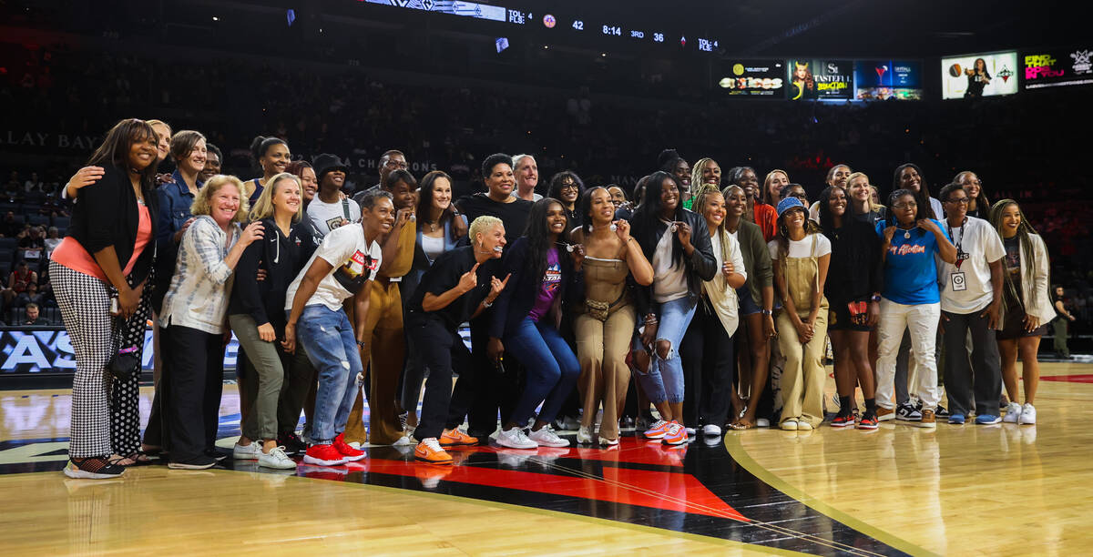 Las Vegas Aces alumni gather on the court at halftime during a WNBA game between the Las Vegas ...