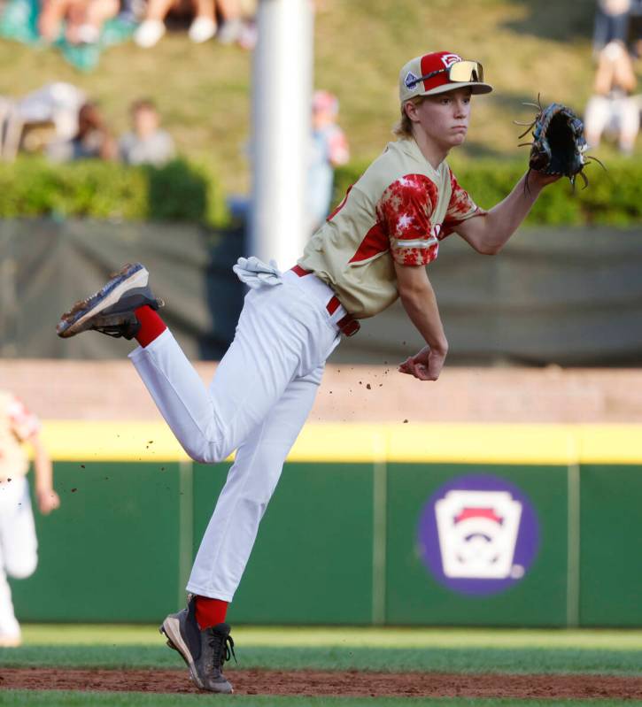 The Henderson All-Stars shortstop Henry Bush throws for an out to first against New Albany, Ohi ...