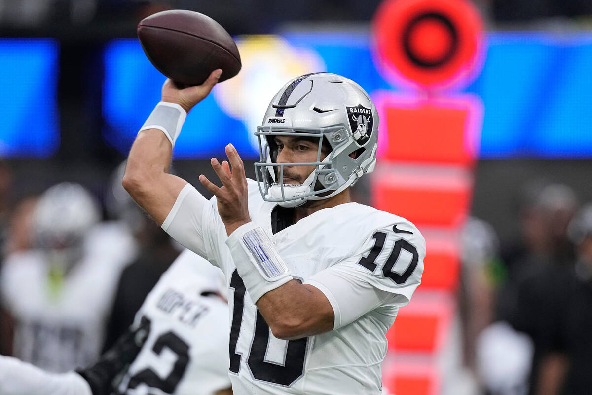 Las Vegas Raiders quarterback Jimmy Garoppolo throws during the first half of a preseason NFL f ...