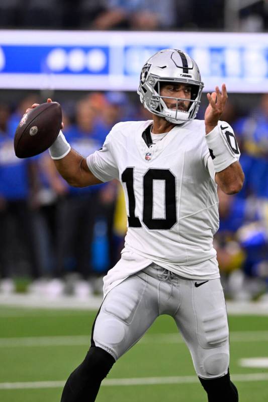Las Vegas Raiders quarterback Jimmy Garoppolo throws during the first half of a preseason NFL f ...