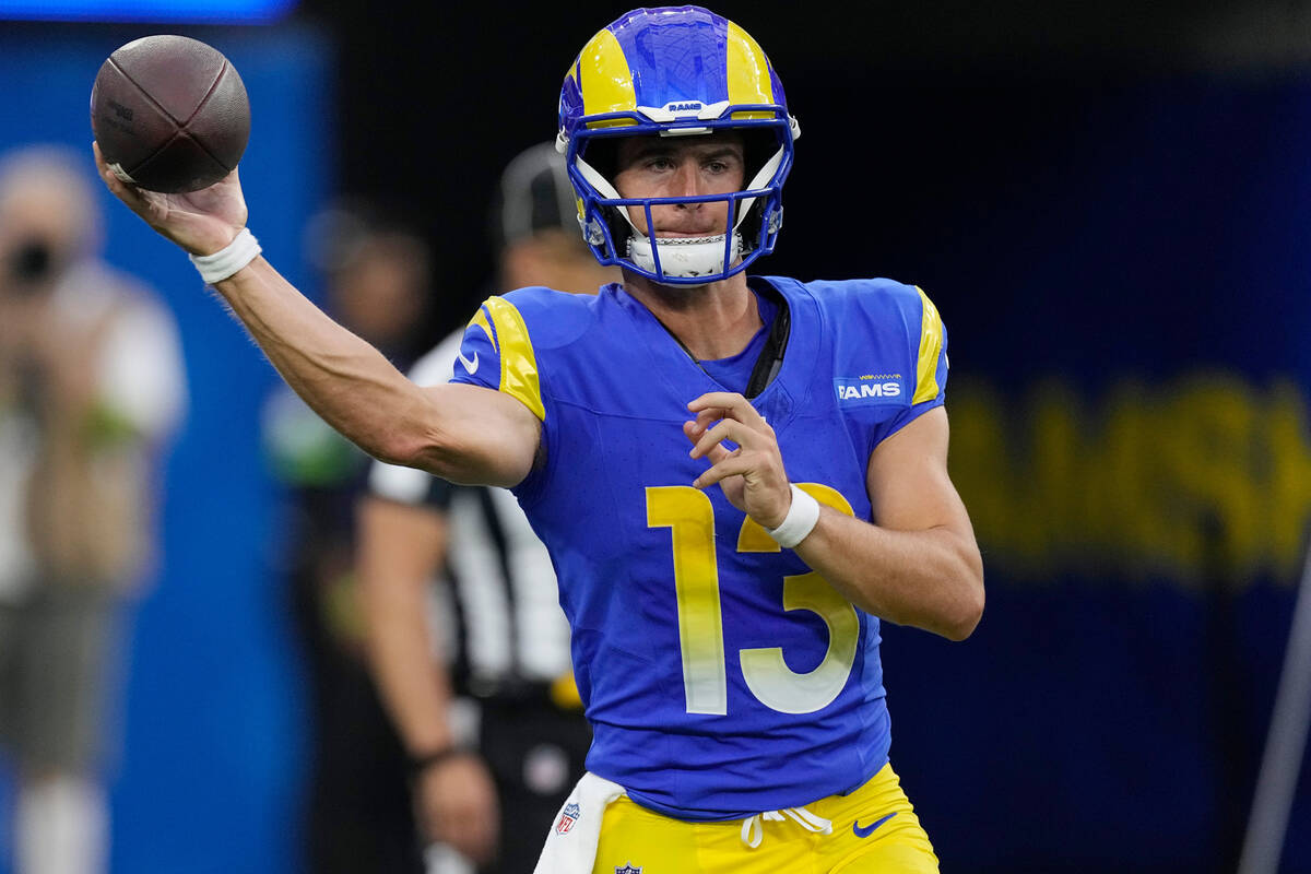 Los Angeles Rams quarterback Stetson Bennett throws during the first half of a preseason NFL fo ...