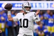 Las Vegas Raiders quarterback Jimmy Garoppolo throws during the first half of a preseason NFL f ...