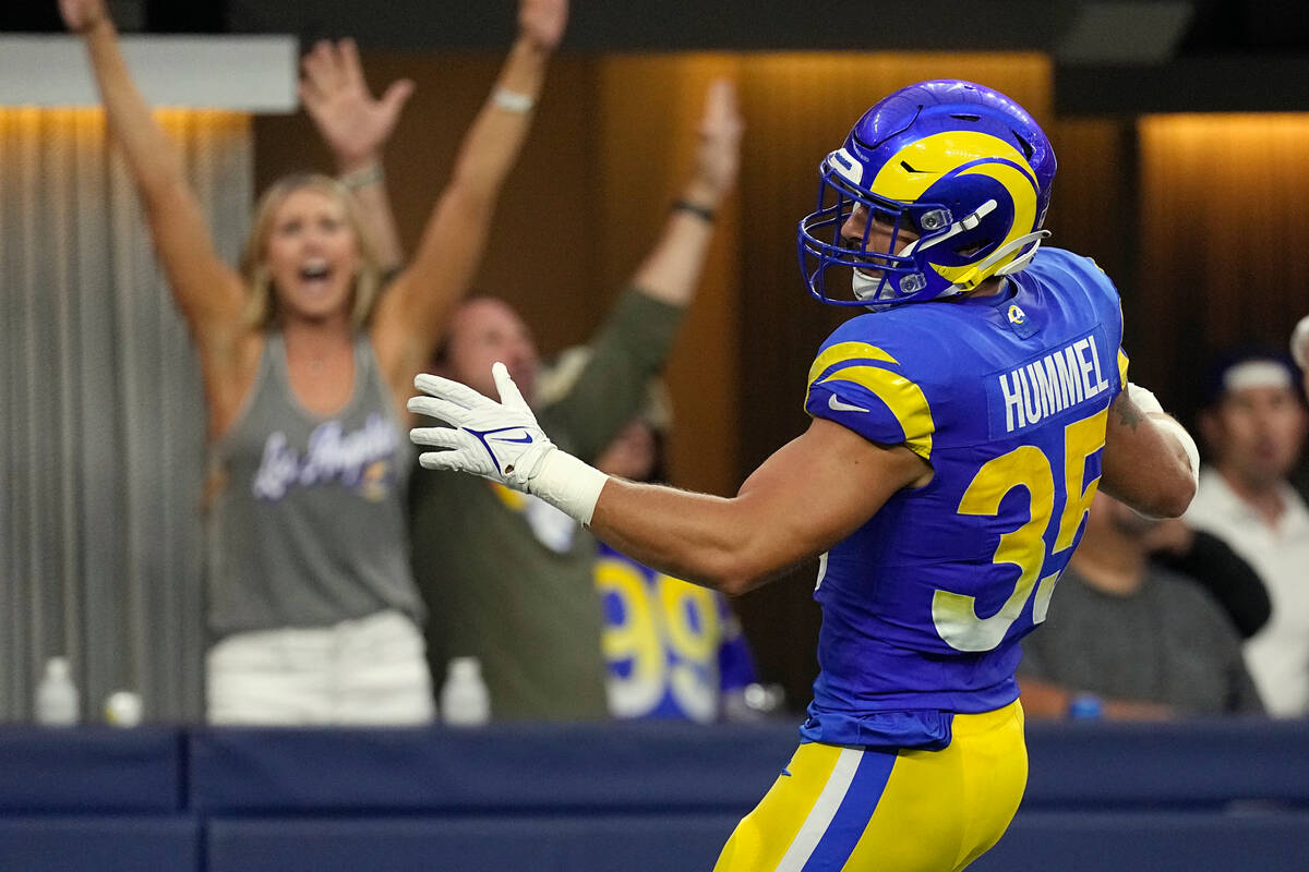 Los Angeles Rams linebacker Jacob Hummel runs an interception back for a touchdown during the f ...