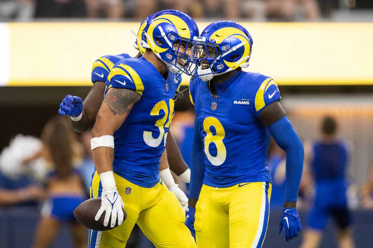 Los Angeles Rams linebacker Jake Hummel (35) celebrates his touchdown with cornerback Robert Ro ...