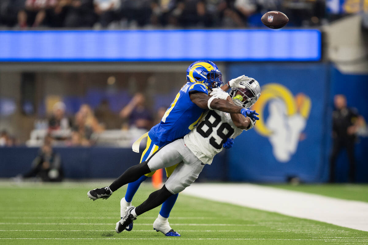 Los Angeles Rams cornerback Cameron McCutcheon (41) stops a pass intended to Las Vegas Raiders ...