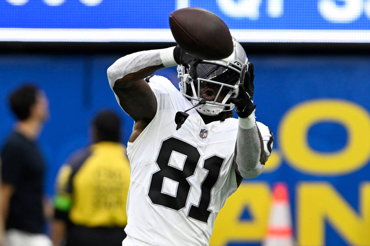 Las Vegas Raiders wide receiver Cam Sims makes a catch before a preseason NFL football game aga ...