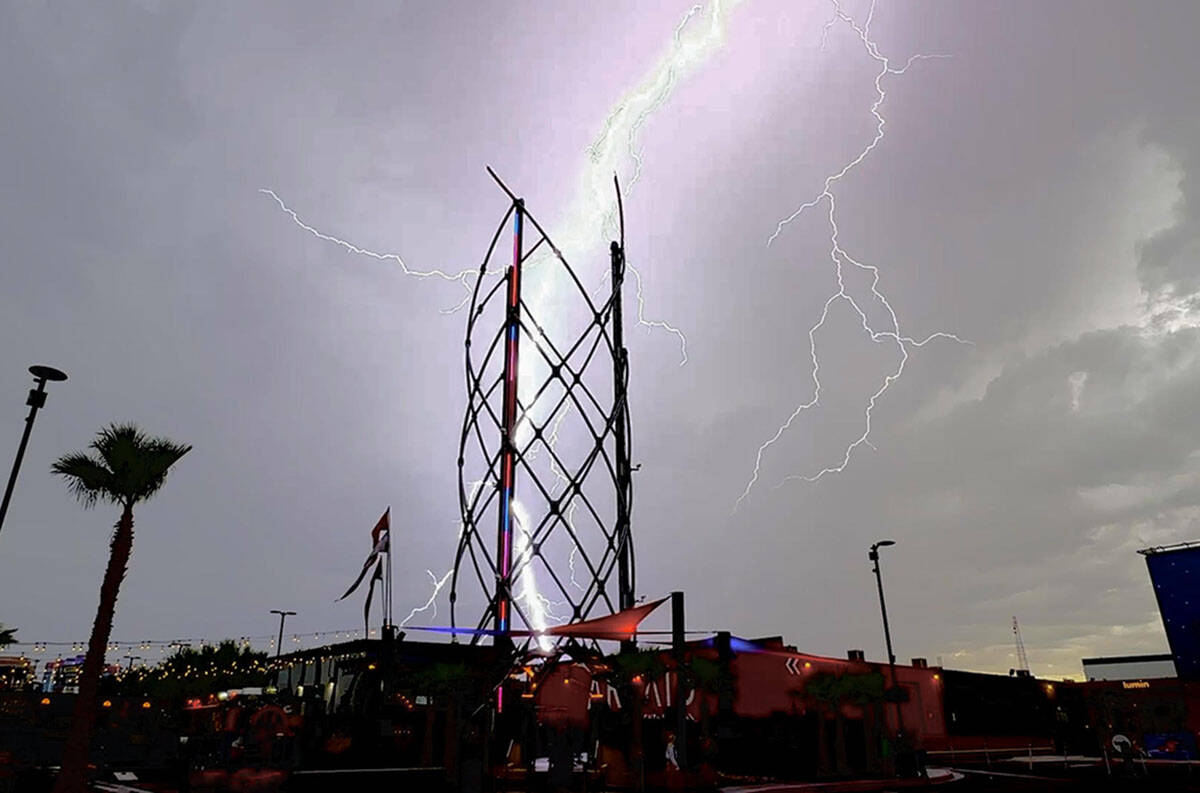 A lightning strike hits at or near the Area 15 entertainment center in Las Vegas on Sunday, Aug ...