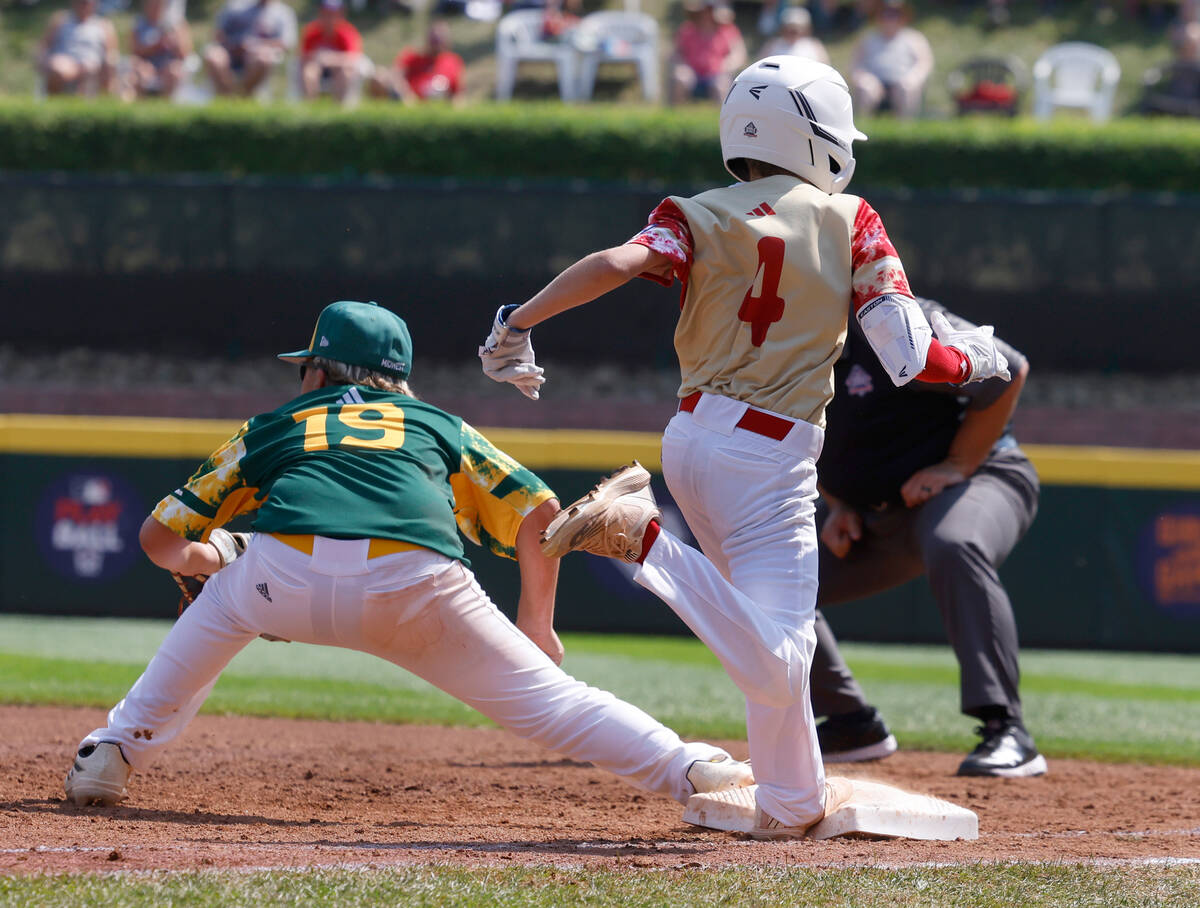 The Henderson All-Stars left fielder Mason Walther (4) beats a throw as Fargo, North Dakota's ...