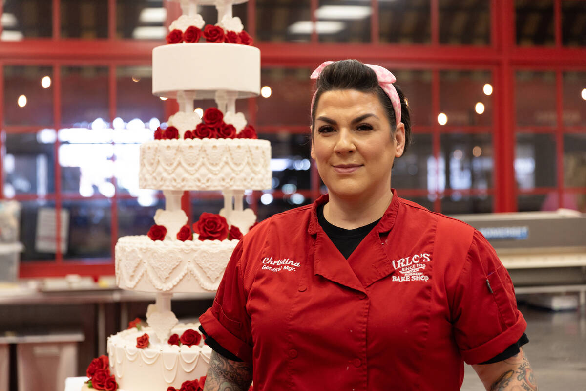 Carlo’s Bake Shop Las Vegas General Manager Christina Nasso is shown with a replica of Elvis ...