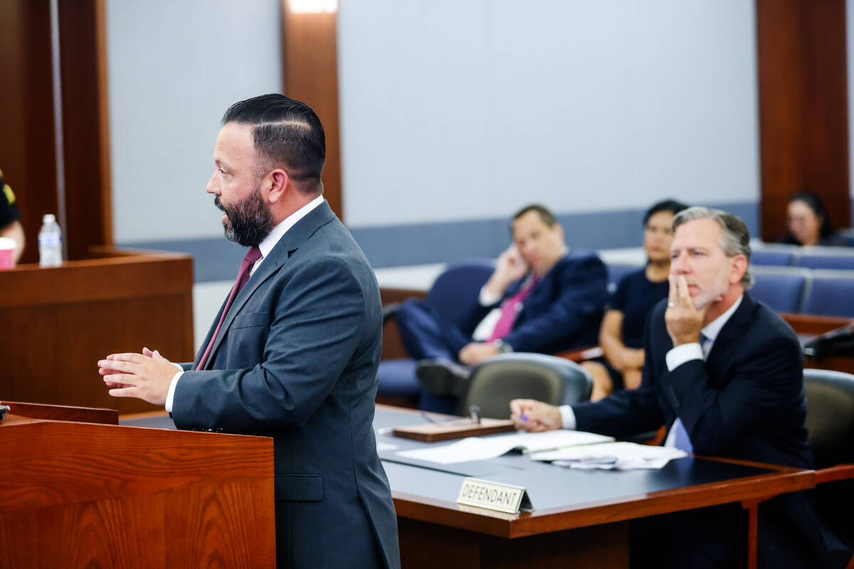 Attorney Ethan Thomas, representing the Clark County School District, left, addresses the judge ...