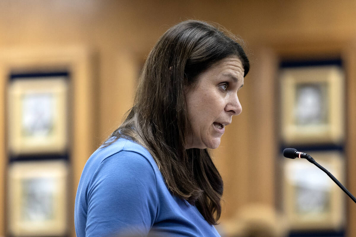 Stacey Segal, a kindergarten teacher at Beverly Mathis Elementary School, gives public commenta ...