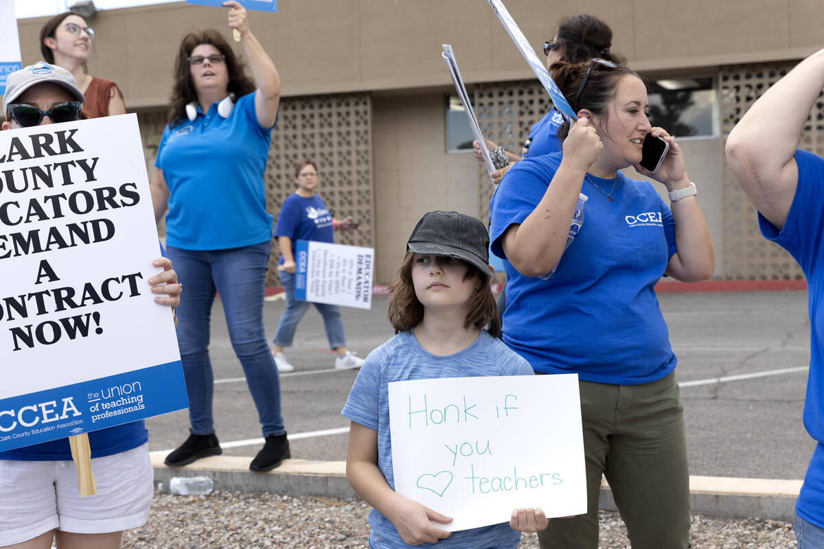 Maddy Bray, 9, joins Clark County Education Association teachers union members in a protest out ...