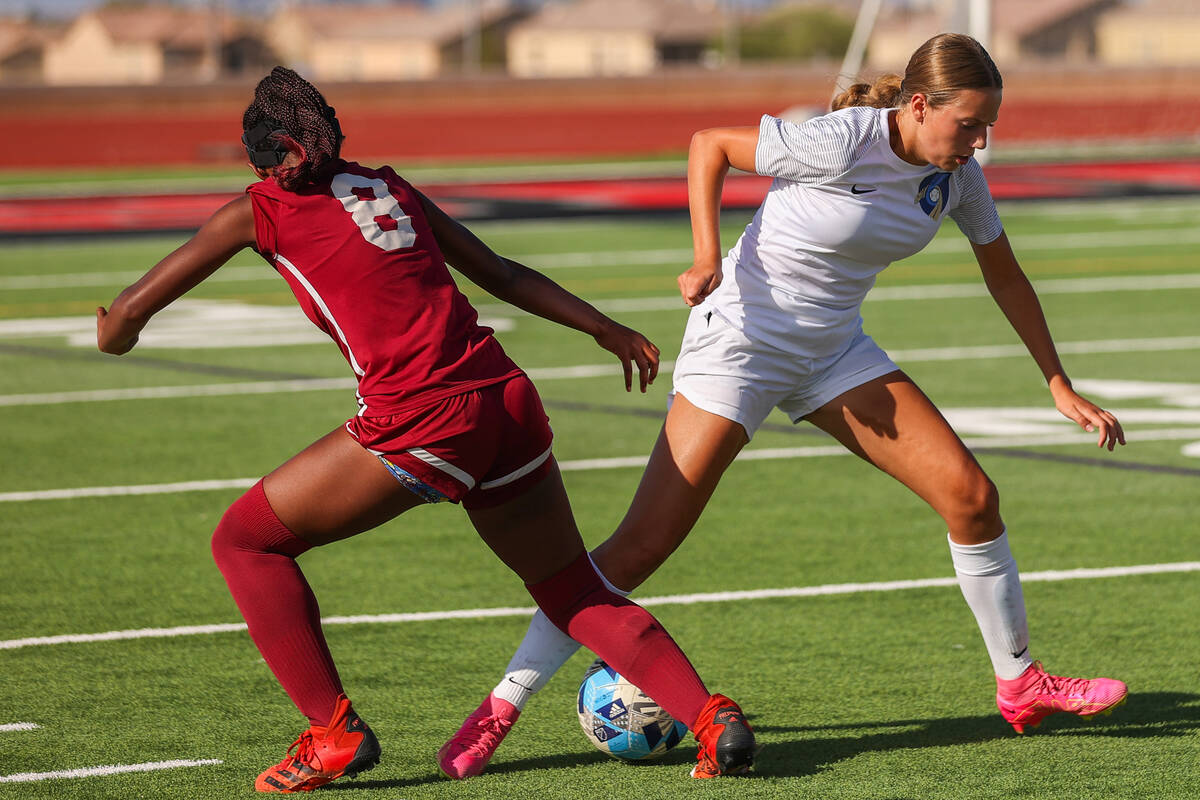 Foothill’s Natalia Hunsaker (5) and Desert Oasis’ Lillian Felise (8) battle for t ...