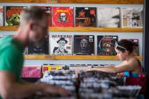 Customers browse the vinyl records at 11th Street Records on Nov. 25, 2017, in downtown Las Veg ...