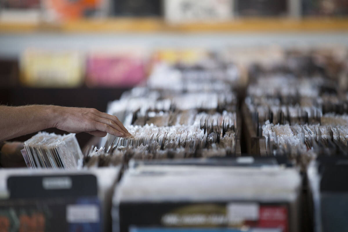 A customer browses the vinyl records at 11th Street Records on Nov. 25, 2017, in downtown Las V ...