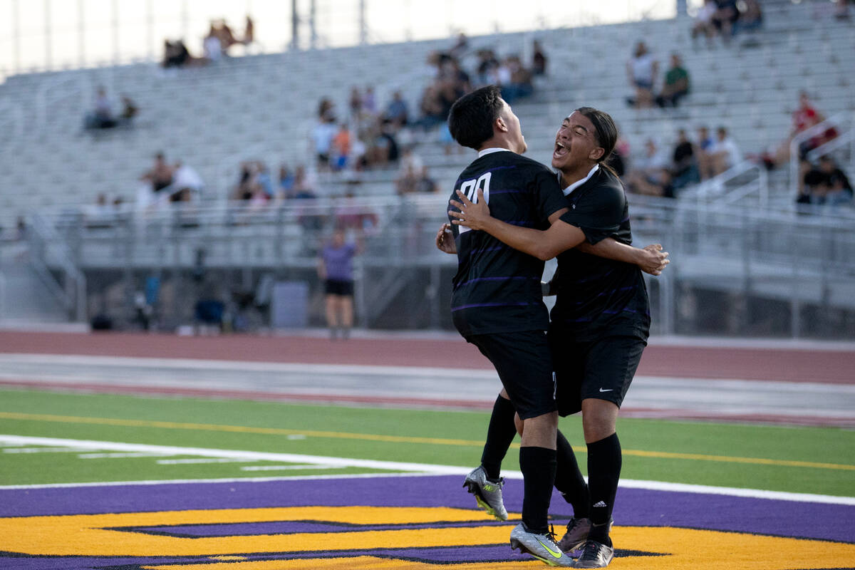 Sunrise Mountain’s Micheal Pelcastre (20) and German Alvarado Parra, right, celebrate th ...