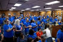 Clark County Education Association teachers union members chant for the CCSD Board of Trustees ...
