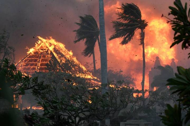 The hall of historic Waiola Church in Lahaina and nearby Lahaina Hongwanji Mission are engulfed ...