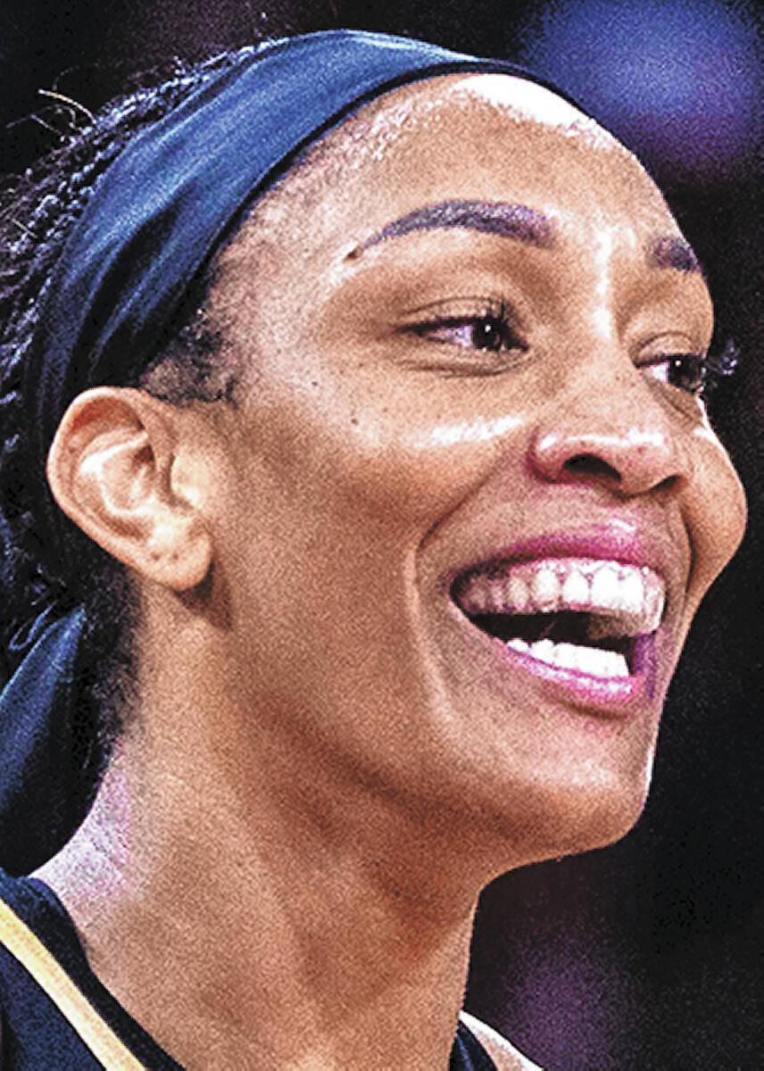 Aces forward A'ja Wilson (22) is happy with her teams domination of the Phoenix Mercury during ...