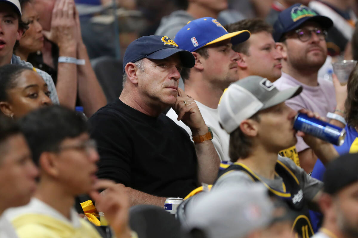 Athletics owner John Fisher, middle, watches during Game 2 of the NBA Finals in San Francisco, ...