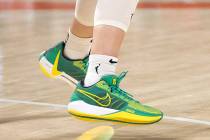 New York Liberty guard Sabrina Ionescu wears her green and yellow Sabrina 1 model Nike brand sh ...