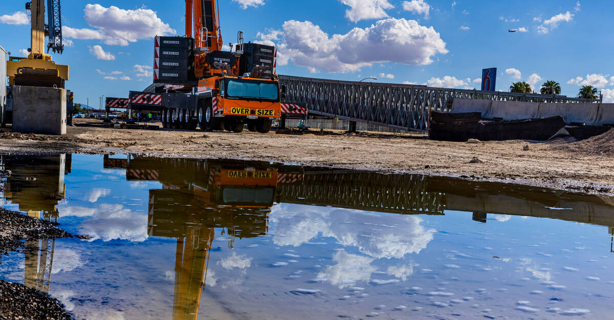 Th span is reflected in a puddle as the Las Vegas Grand Prix, Inc. gives a preview of the tempo ...