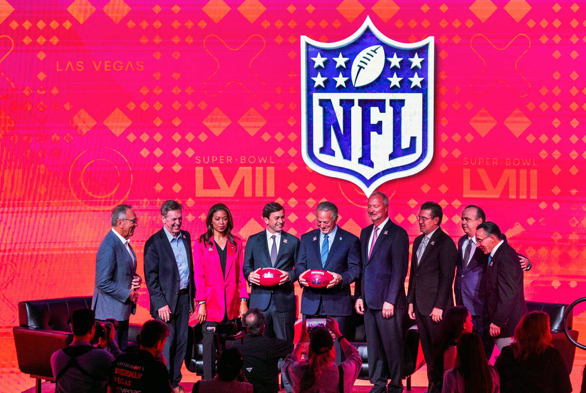 Invited dignitaries come together join stage as the National Football League and the Las Vegas ...
