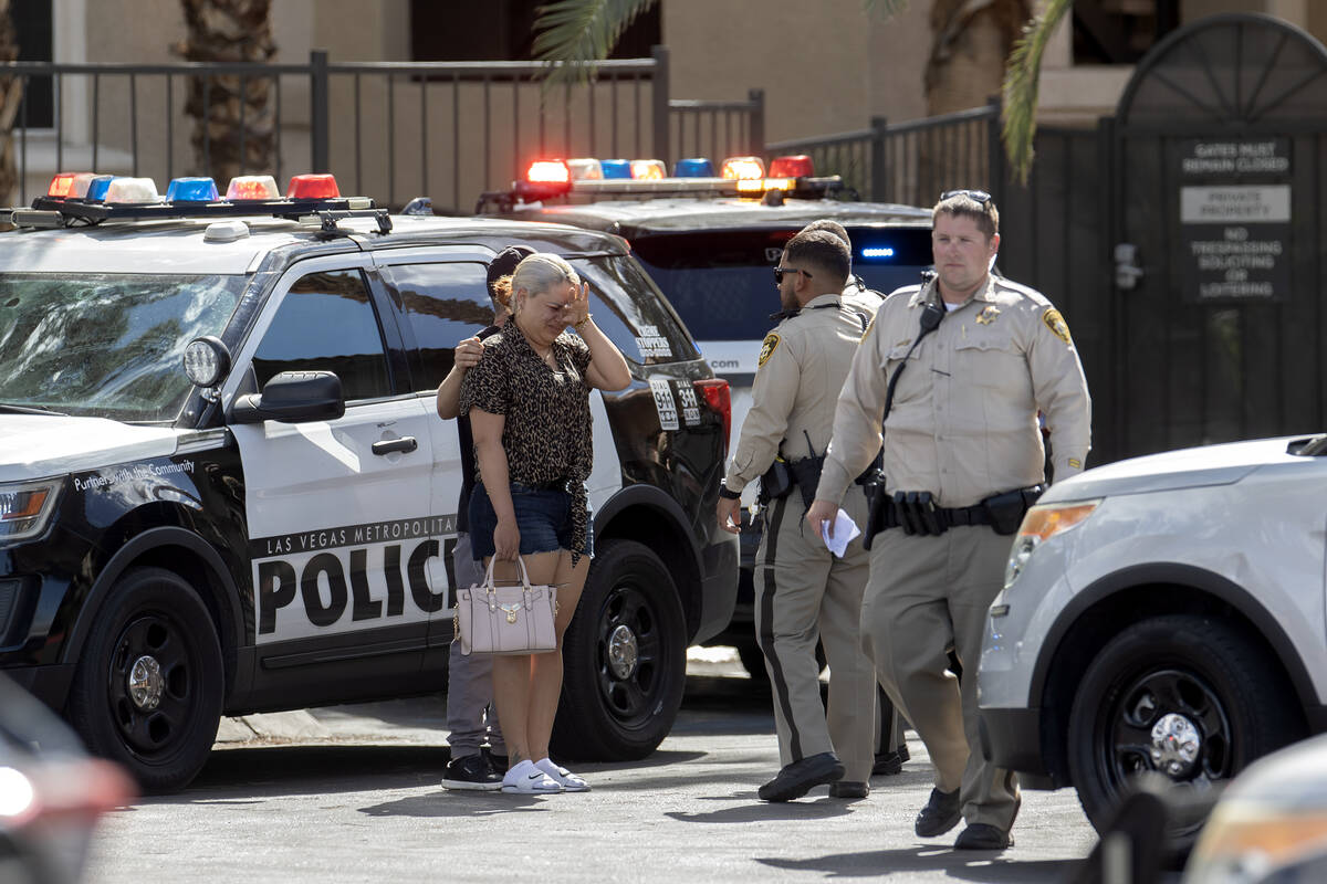 Metropolitan Police Department officers investigate the scene of a shooting in a senior apartme ...