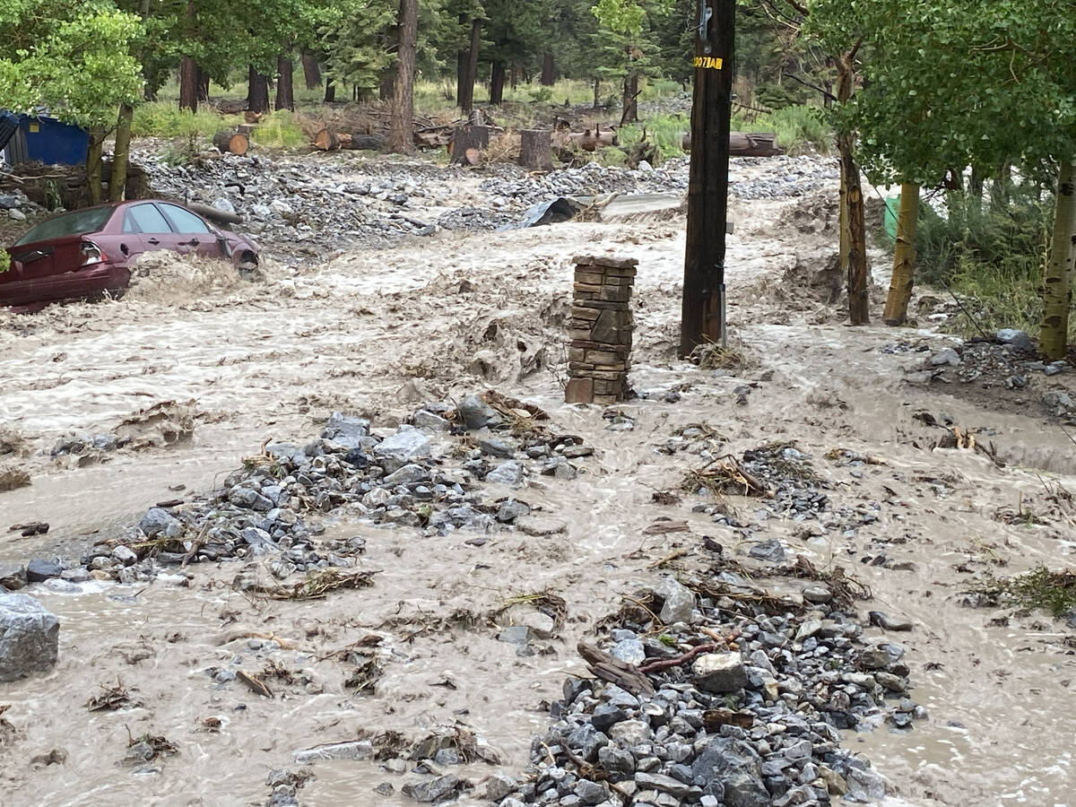 Water flows fast in the Echo subdivision on Mount Charleston on Monday, Aug. 21, 2023. (Brenda ...