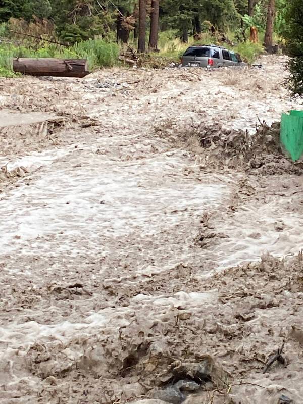 Water flows fast in the Echo subdivision on Mount Charleston on Monday, Aug. 21, 2023. (Brenda ...