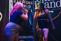 Portia Glommen, right, sings in the duet category with Megan Schraeder during the Karaoke World ...