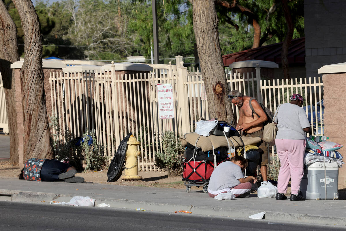 People congregate on Main Street at Foremaster Lane near the Courtyard Homeless Resource Center ...