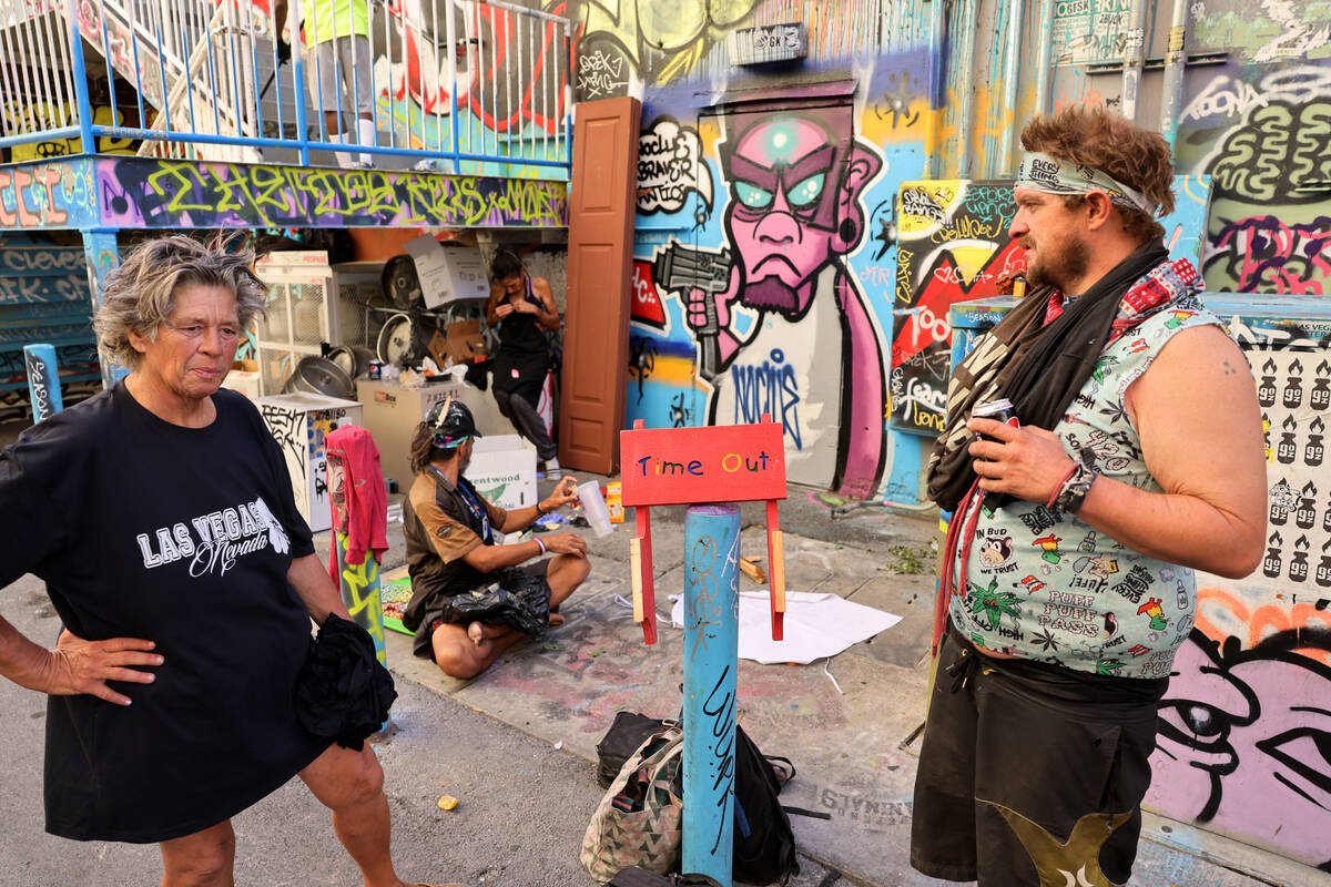 Tina Katkus-Smith, 59, and Stephen Taber, 41, who said they are homeless, hang out in an alley ...