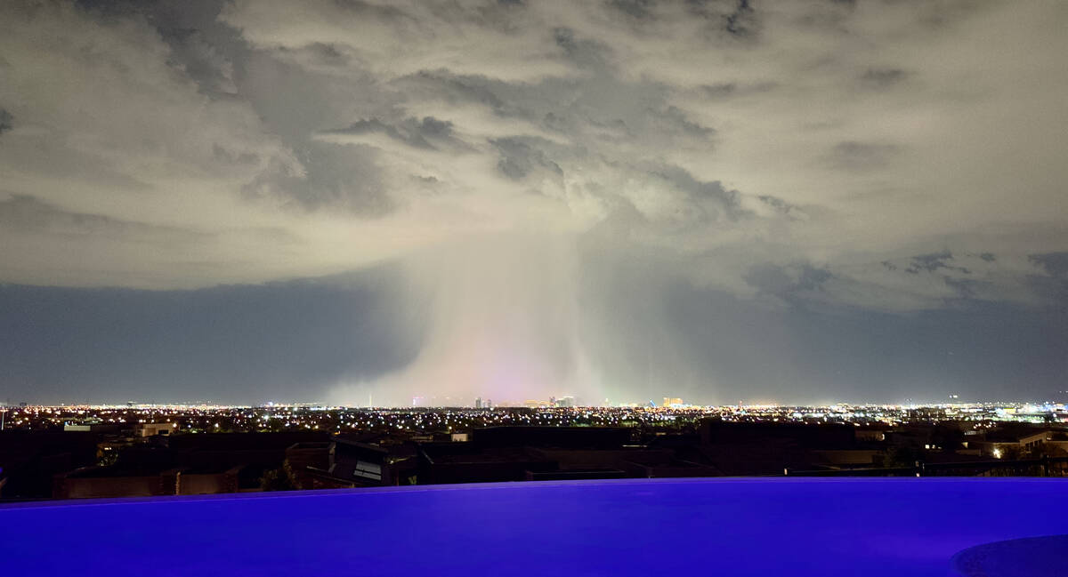 A shot of the Strip from a distance as a storm cell drops heavy rain on Wednesday, Aug. 23, 202 ...