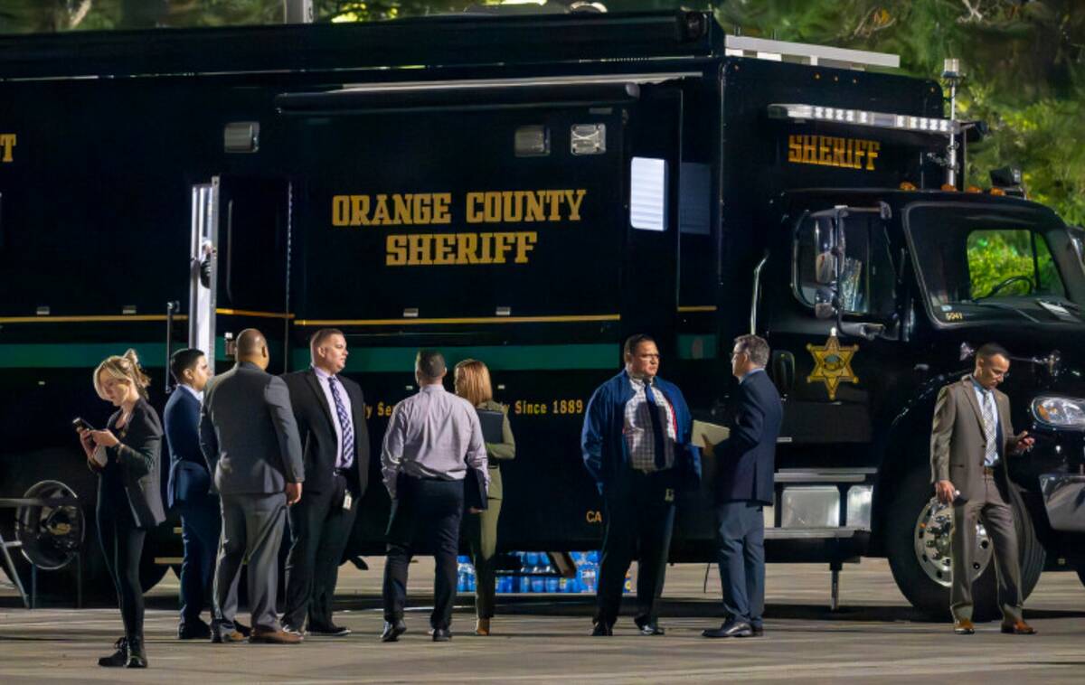 The Orange County aheriff's mobile command post uses the parking lot at Saddleback Church as as ...