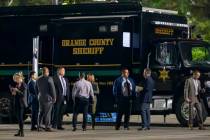 The Orange County aheriff's mobile command post uses the parking lot at Saddleback Church as as ...
