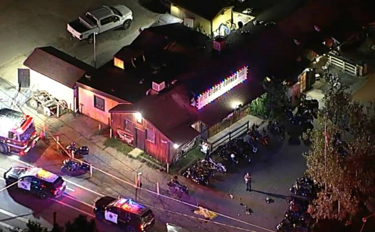 Authorities work at the scene of a fatal shooting Wednesday, Aug. 23, 2023, at Cook's Corner, a ...