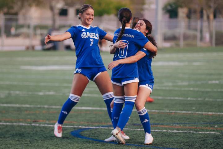 Bishop Gorman’s Stephenie Hackett (10) celebrates with her teammates after making a penalty k ...