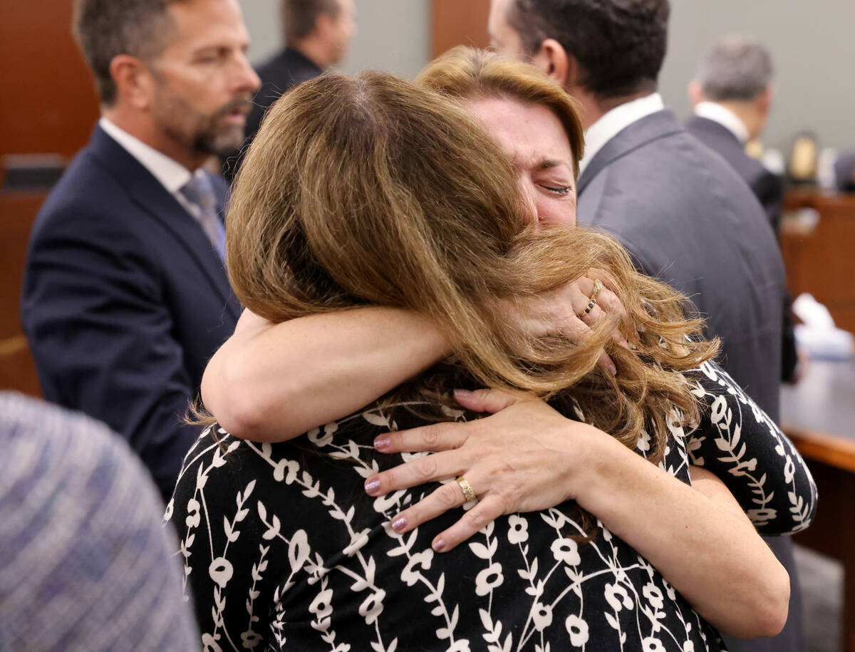 Colleen Beyer, daughter of murder victim Sharon Causse Randolph, facing, hugs Prosecutor Pam We ...
