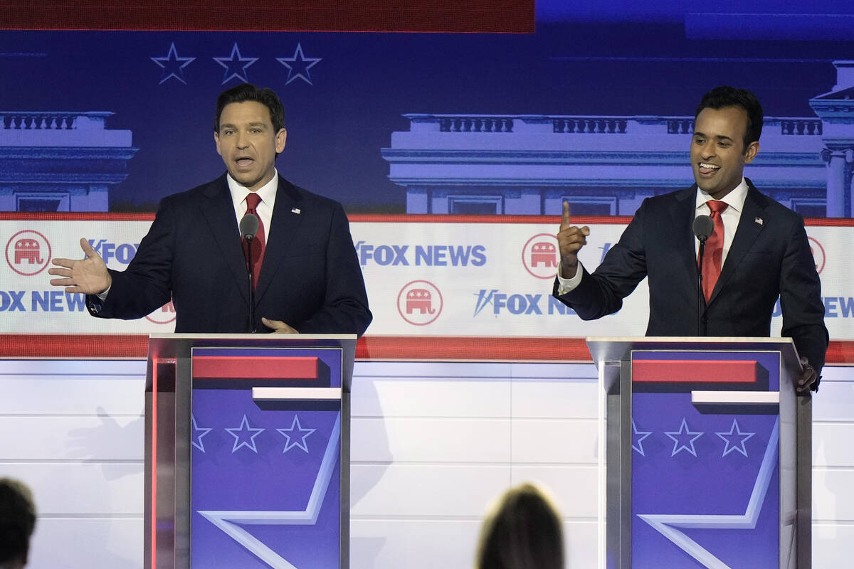 Florida Gov. Ron DeSantis and businessman Vivek Ramaswamy speak at the same time during a Repub ...