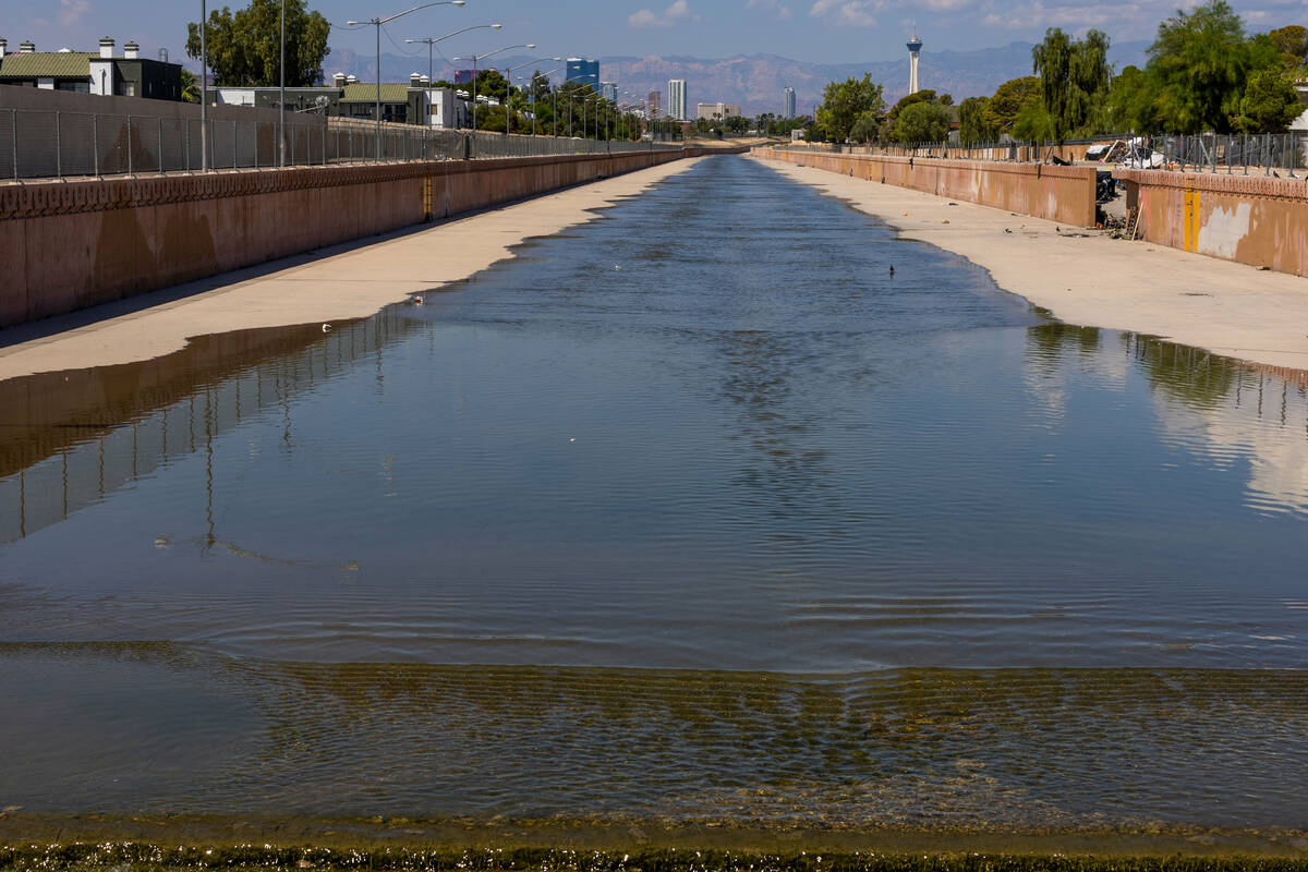 Water in a wash moves along at South Nellis Boulevard upstream is where an individual was swept ...