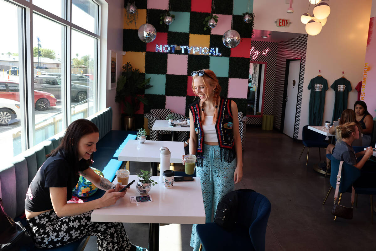 Ashley Melton, left, and Ellen Strecker, both of Phoenix, mingle at Dig It Coffee Co. as work c ...