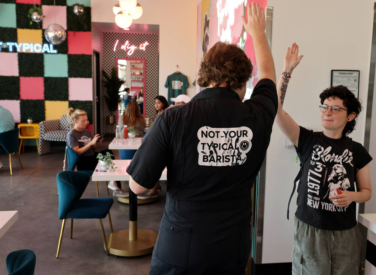 Assistant barista Jesse Berry, left, high fives Manager Arlo Rowland at Dig It Coffee Co. on Ca ...