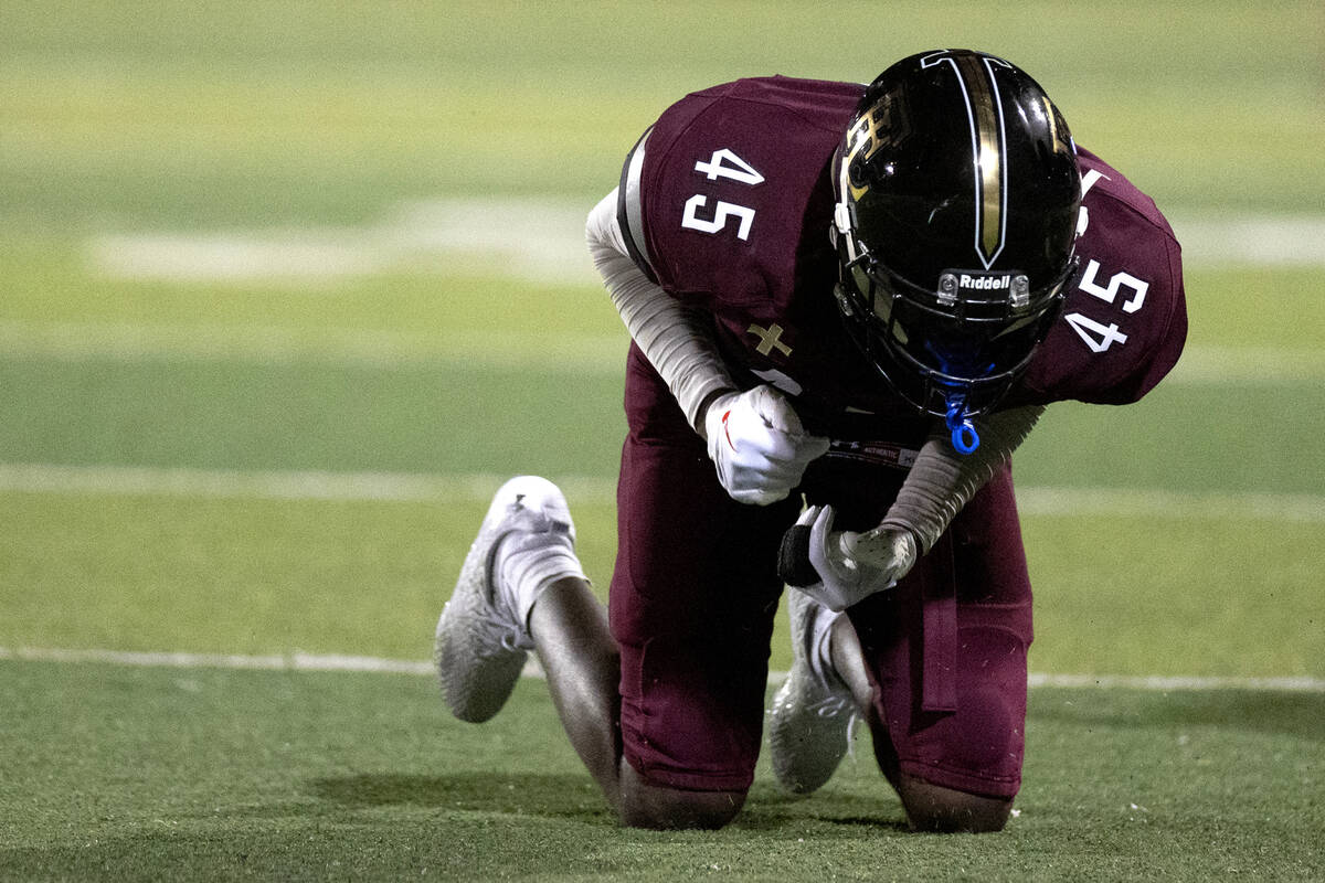 Faith Lutheran wide receiver Micah Mumford (45) reacts after missing a catch during a high scho ...